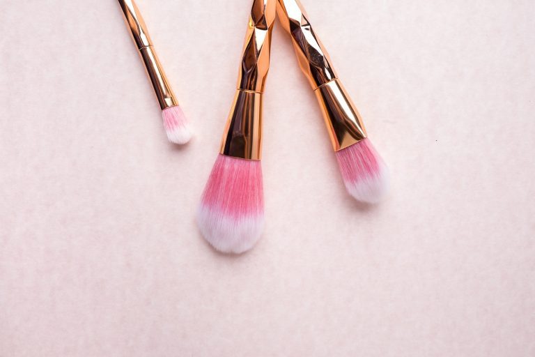 gold-colored makeup brushes