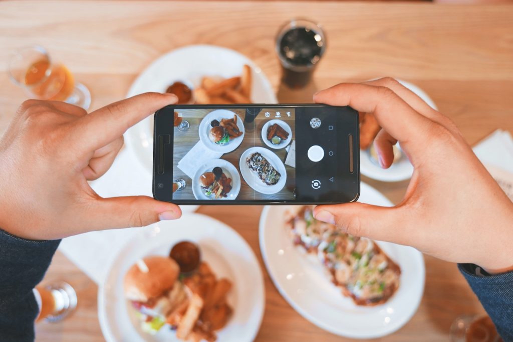 influencer taking picture of the foods